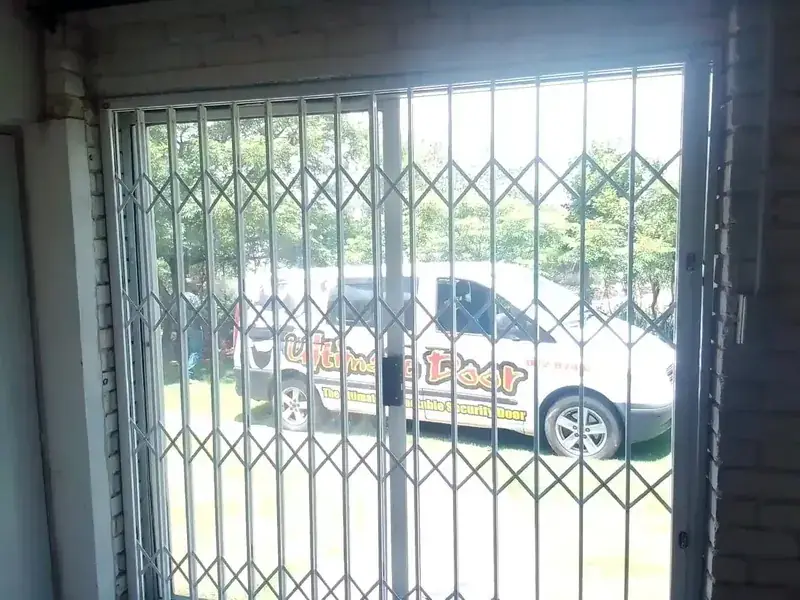 Large retractable security gate across a driveway